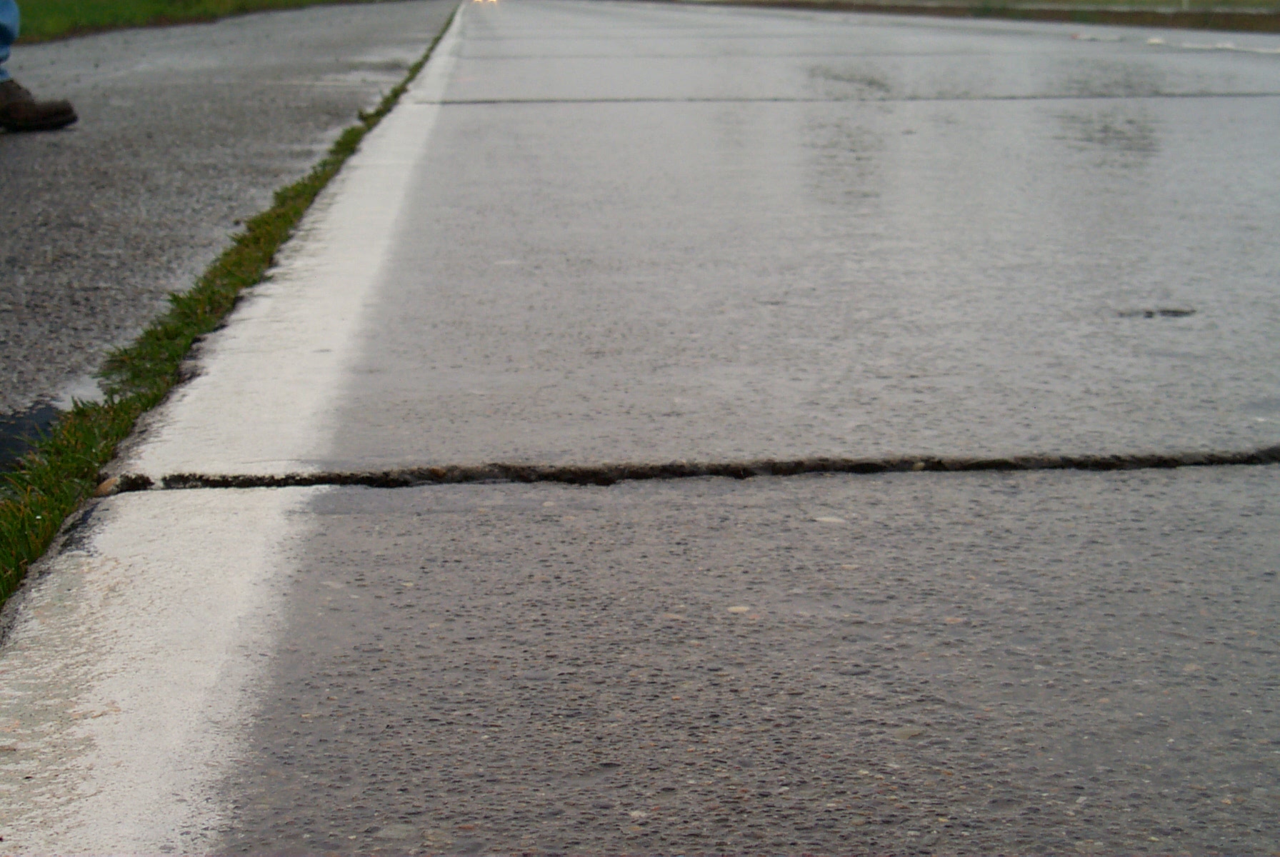Sand in pavement joints can lead to the faulting shown here.