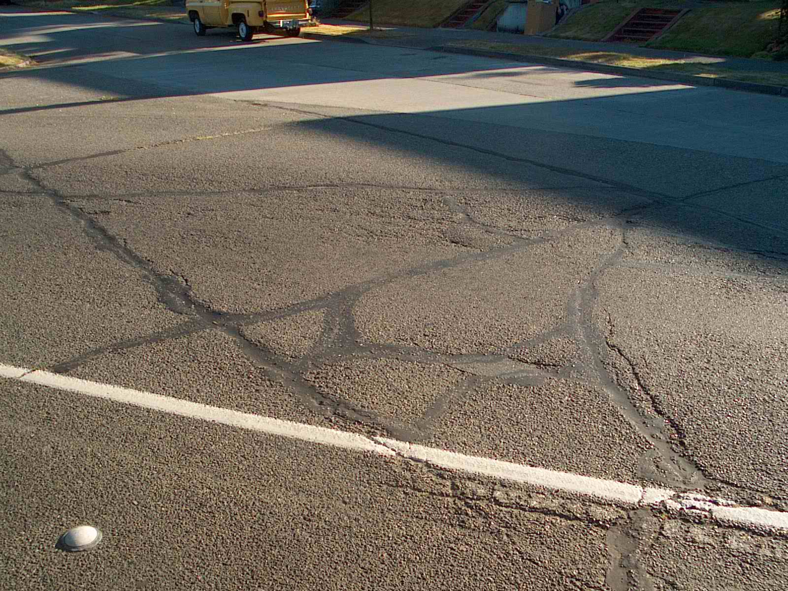 Crack sealing on western Oregon road to repair transverse cracks.