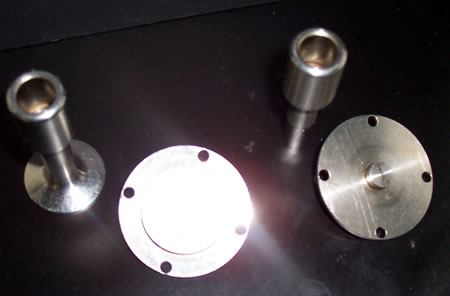 Upper and lower plates for the 25 mm diameter sample (left) and the 8 mm diameter sample (right).